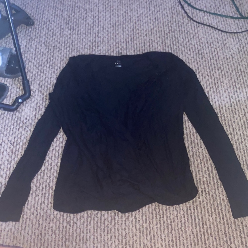 A black long sleeve cross cross shirt. Unworn.